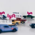 Cars with Lyft and Uber signs